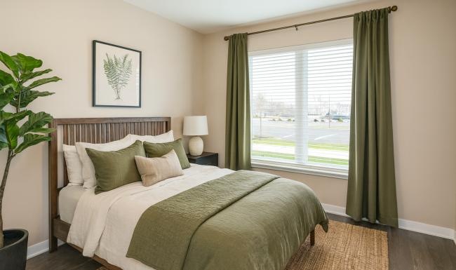 Relax and recharge in beautiful and spacious bedrooms a bedroom with a bed and a large window
