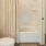 a bathroom with a tub and toilet