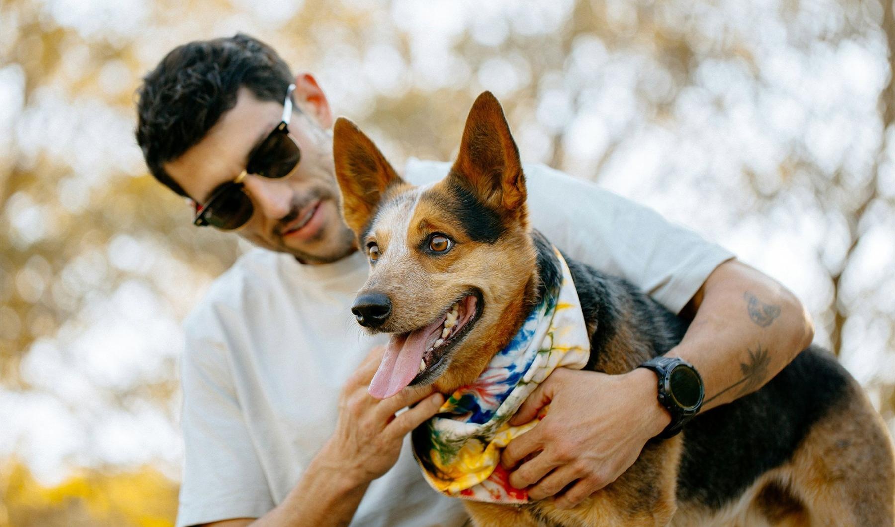 We welcome all your furry friends a person holding a dog