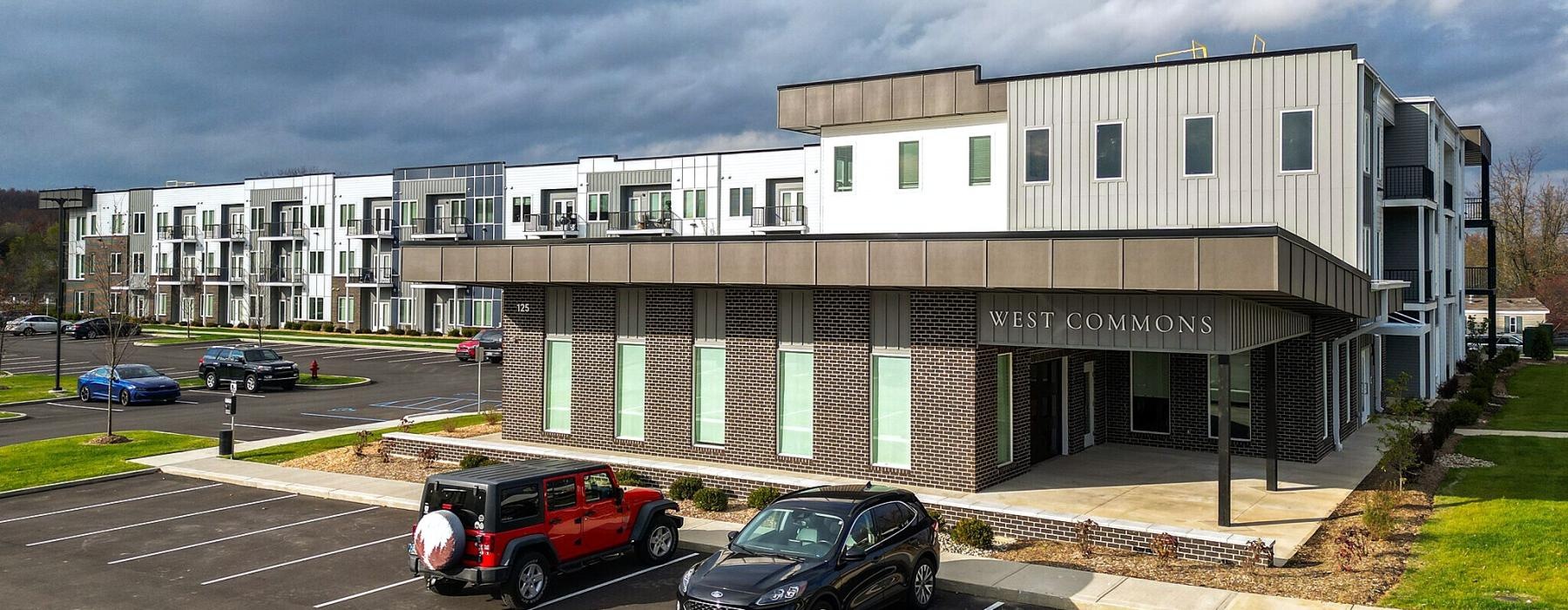 a building with cars parked in front