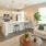 a living room with a kitchen island beyond