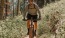 man riding a bike on a trail in the woods